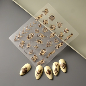 Leopard print nail stickers with gold foil geometric patterns and leopard spots