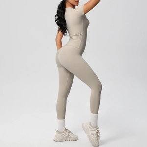 Side view detail of beige seamless high-stretch yoga set with t-shirt and high waist leggings