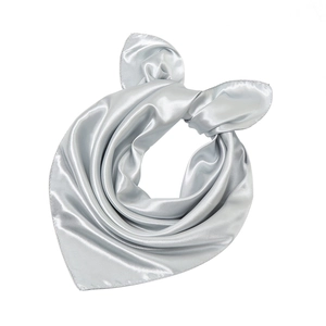 Detailed close-up of silver-grey satin silk scarf showing smooth lustrous texture and folds