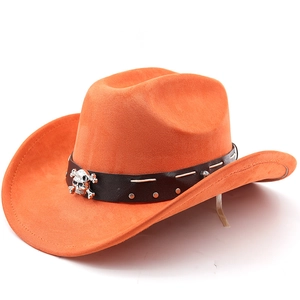 Top view of bright orange suede cowboy hat with studded leather band and skull accent