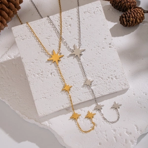 Elegante gold- und silberfarbene Edelstahl Stern-Y-Halskette mit Quasten im minimalistischen Stil