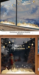 Detail of champagne gold Merry Christmas glass stickers with snowflake and tree silhouettes