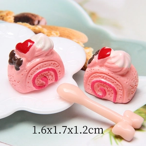 Miniature pink resin cake roll charms with heart and bow details, size 1.6x1.7x1.2cm