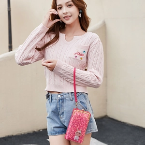 Pink sequin crossbody phone bag with rabbit ornament and gold metallic frame on strap