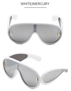 Detail of white shield sunglasses with grey mercury lens and gold metal accents
