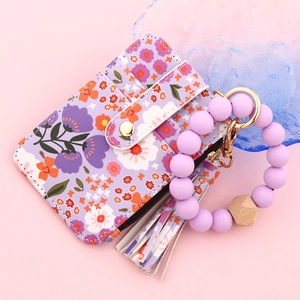 Floral silicone bead bracelet with purple patterned leather card holder wallet and tassel