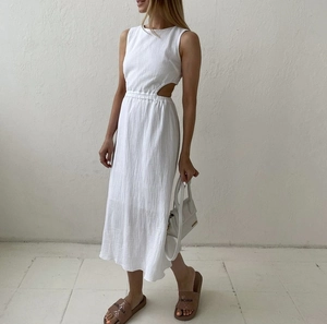 White sleeveless midi dress with waist cut-outs and minimalist textured cotton fabric