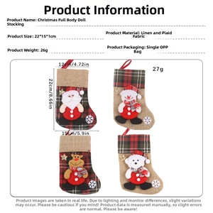 Detail view of linen Christmas stocking with dimensions showing rustic weave and plaid fabric
