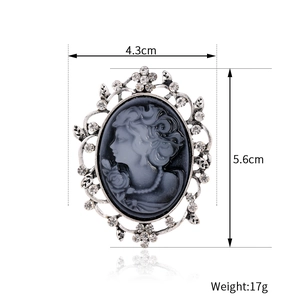 Retro rhinestone portrait brooch with floral silver frame and dimensions 4.3x5.6cm