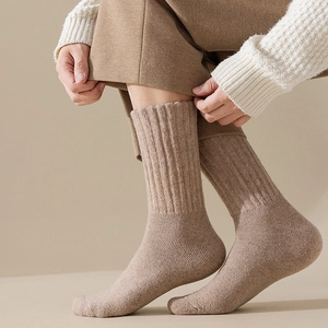 Thick light brown wool crew socks for men featuring classic ribbed texture and warm fit