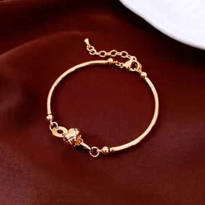 Elegant 18K gold plated bamboo link bracelet featuring a textured spherical charm