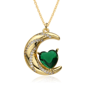 Ethnic gold crescent moon necklace featuring a green heart zircon and pavé crystals