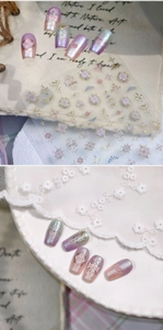 Detailed 3D star and moon nail art stickers with metallic gold and purple gradient patterns