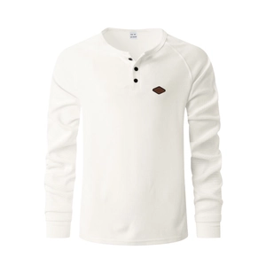 Detail of white waffle knit fabric and buttoned neckline on a long sleeve Henley shirt