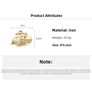 Macro shot of gold-toned leaf brooch in iron material weighing 29.5g with metallic finish