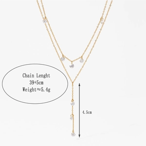 Double-layered Y-shaped gold necklace with sparkling rhinestones and adjustable extension chain