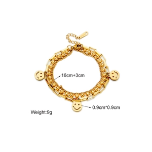 Detail of gold multilayer chain bracelet with smiley face charms and size specifications