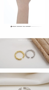 Close-up of S925 sterling silver rings showing golden and silver lava texture detail