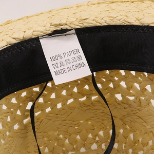 Detailed macro view of 100% paper fiber weave and inner sweatband on summer sun hat