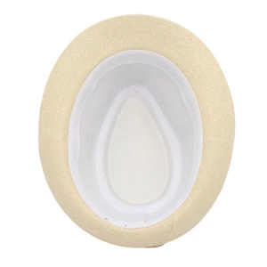 Detailed inner view of beige straw hat showing fine weaving and white inner sweatband