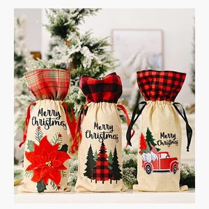Detail of Christmas burlap wine bags with checkered trim and festive truck patterns