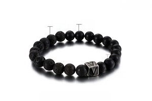 Detail of 8mm volcanic rock and agate beads with a stainless steel 'V' letter charm