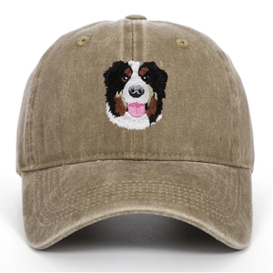 Detailed embroidery of a Bernese Mountain Dog on a vintage washed cotton baseball cap
