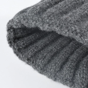 Deep grey chunky ribbed knit beanie for women showing a thick warm texture for winter