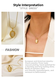 Detailed macro view of the oval cat eye stone pendant and golden snake bone chain