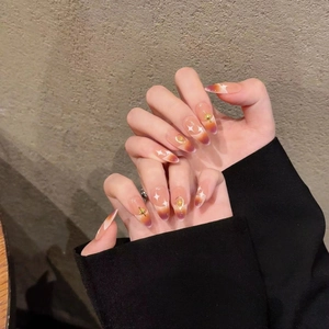 Long oval press-on nails with purple gradient, golden stars and moon charms