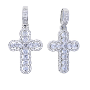 Detail showing two hollow cross pendants with cubic zirconia in silver-toned finish