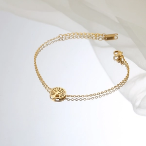 Elegant gold stainless steel Tree of Life charm bracelet with adjustable lobster clasp closure