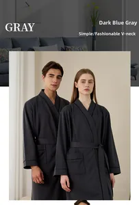 Detailed close-up of dark grey waffle texture fabric on a V-neck couple's bathrobe
