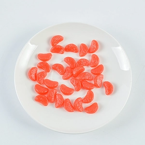Realistic PVC mini orange slice models with detailed pulp texture on a white plate