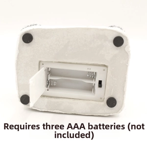 Detail view of the Christmas ornament base with a 3 AAA battery compartment and switch