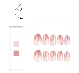 Pink gradient press-on nails set with silver glitter tips and pearl rhinestone accents