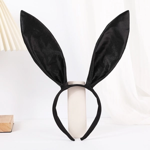 Elegant black satin bunny ear headband for Easter or Halloween costumes on white background