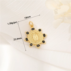Detail of 14K gold Mary pendant with black zircon and dimensions 18mm by 25.4mm