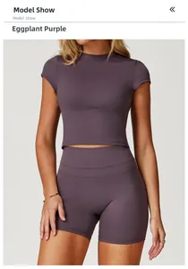 Detail of eggplant purple athletic crop top and shorts set with moisture-wicking fabric