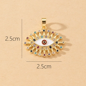 Detailed view of gold devil's eye pendant with colorful zircons and size markings