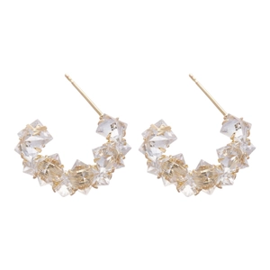 Elegant gold C-shaped hoop earrings with sparkling cubic zirconia crystals for women