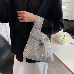 Sparkling silver knot bag with dense rhinestones for elegant evening and party wear