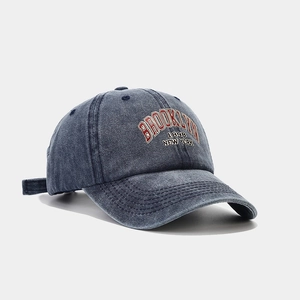 Close-up of vintage washed navy baseball cap with Brooklyn 1898 letter embroidery