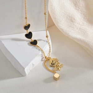Gold stainless steel necklace with black heart charms and a 3D rose flower pendant