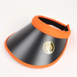 Close-up of bright orange sun visor with UPF 50+ UV protection sticker on black brim