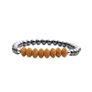 Detail of hematite beads and brown volcanic lava stones on a beaded bracelet