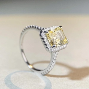 Radiant cut yellow gemstone ring in 925 sterling silver halo setting with micro pavé band