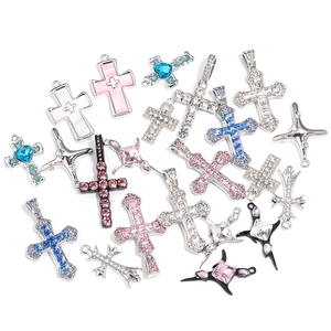 Detailed close-up of various colorful rhinestone cross pendants for DIY jewelry making