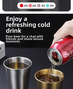 Action shot of beer pouring into brushed stainless steel and gold metal cold drink cups