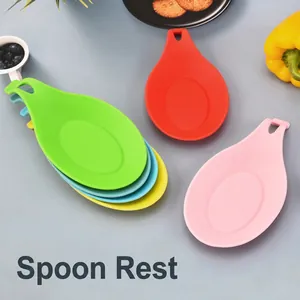 Colorful heat-resistant TPE spoon rests in five vibrant colors with a hanging hole design